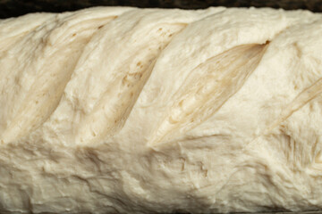 raw bread dough with diagonal cuts decoration
