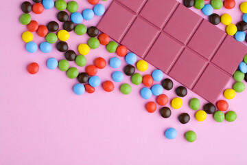 ruby chocolate bar with colorful chocolate candy tablets