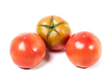 Composition with whole red tomatoes isolate on white background