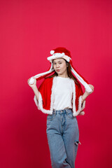 Mockup Image of an Asian Woman Wearing White Blank Shirt With Christmas Outer on a Red Background