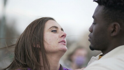 Interracial couple kissing, candid tender affection millennial couple2