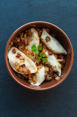 national Ukrainian dish, traditional varenyki with potatoes, cabbage, crackers made of lard and fried onions, food of the countries of the world, gastrotourism, culture of Ukraine