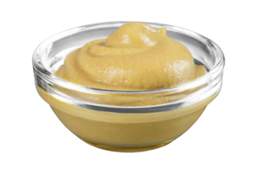 Burning yellow mustard in a glass cup on a white background