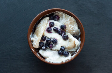 national Ukrainian dish, traditional sweet varenyki with homemade cottage cheese, cottage cheese and blueberries, food of countries of the world, gastrotourism, culture of Ukraine