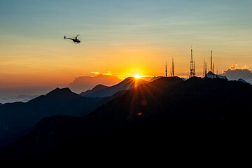 helicopter at sunset over the brazilian city of rio de janeiro. tourist attraction