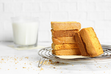 cookies stacked with milk on white background 