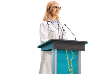 Smiling female doctor giving a speech on a pedestal