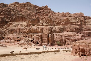 Fototapeta na wymiar Street of Facades and dry riverbad of Wadi Musa in Petra, Jordan. Petra is ancient Nabataean city, considered one of seven new wonders of world and is world heritage site.