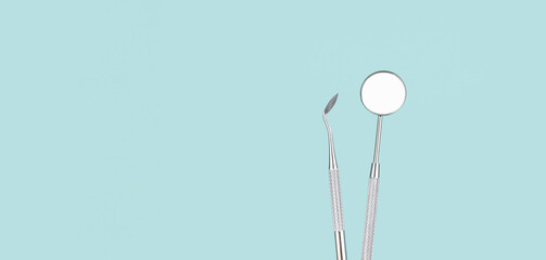 Dentist Professional tools medical equipment on Blue background. Dental Hygiene and Health conceptual image Dental tools on blue background. Medical technology concept.