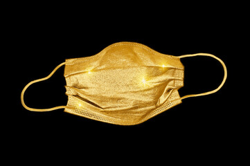 Golden mask for COVID virus pandemic. Doctor mask and corona virus protection isolated on a black background