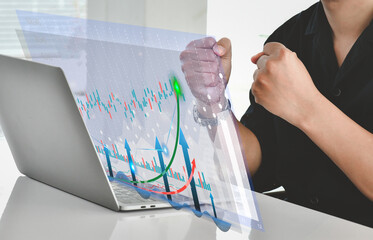 Business man celebration and happy.Investment concept and business finance technology. Stock Market Investments Funds and Digital Assets,analyzing trading graph financial data.