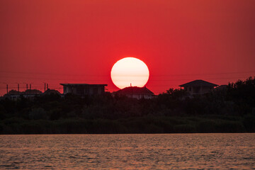 The sun goes down over a lake