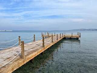 Beautiful wooden pier at the sea, sea horizon