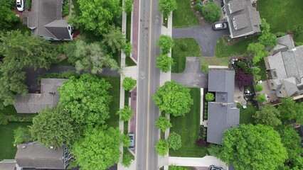 Establishing landscape aerial of expensive, upper class neighborhood estates, large homes, mansions, and green lawns with swimming pools in high-income suburb sprawl in Midwest Columbus, Ohio, USA
