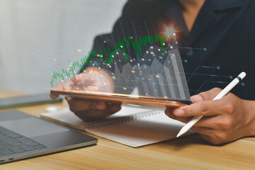 Businessman working and analyzing graph,planning and strategy, Stock market, trader or investor,Technical price graph and indicator,finance technology and investment concept.Funds and Digital Assets