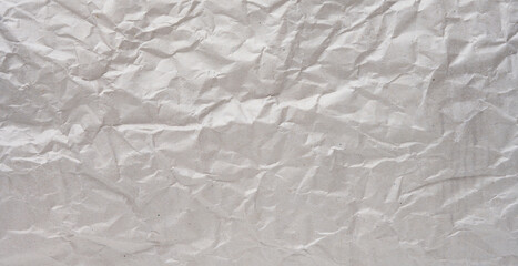 Texture of gray crumpled craft paper, full frame