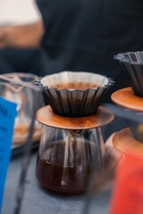Vertical shot of a process of making an expresso coffee with an  equipment