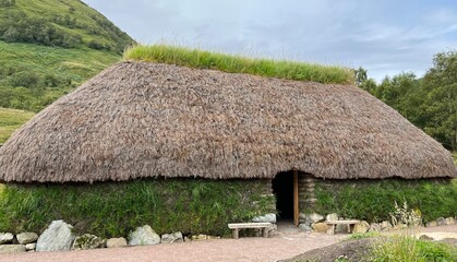 Fototapeta na wymiar Traditional thatched cottage built in Highland Scotland