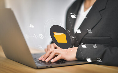 Document Management System (DMS), online documentation database and process automation to efficiently manage files, knowledge and documentation in enterprise with ERP. IT consultant working on laptop