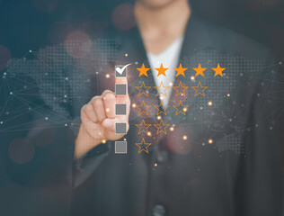 Customer service and Satisfaction concept ,Business people are touching the virtual screen on the happy Smiley face icon to give satisfaction in service. rating very impressed