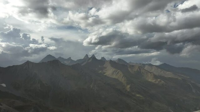 clouds over the mountains in french alps end summer 