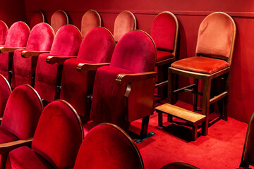 Red velvet seats of an opera house.