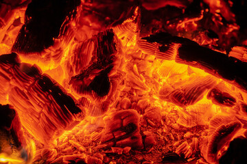 Fiery hot coal in orange glow