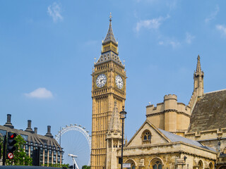 Fototapeta na wymiar London Eye ferris wheel behind Westminster Tower