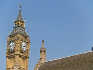 Fototapeta na wymiar Big Ben ornate clock tower against blue sky