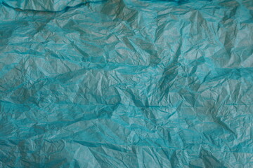 Fototapeta na wymiar Textured Blue-Green Wrapping Paper Tissue as Background