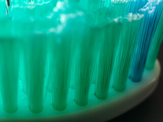 Toothbrush macro. New toothbrush with bristles on the plastic base. oothbrush head and bristles...