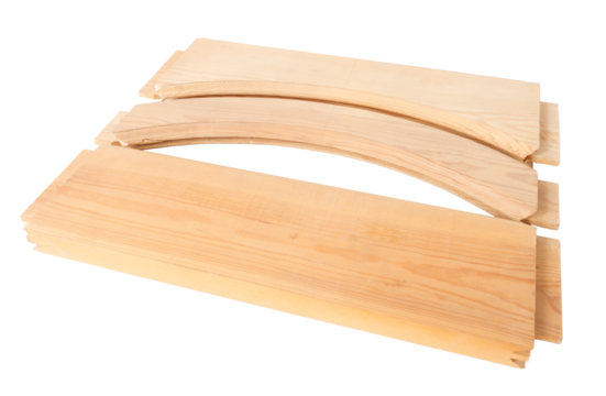 wooden blanks for assembling doors, processed by a milling machine, on a white surface