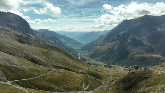 Summer in the mountain french alps aerial shot green grazing with dirt road