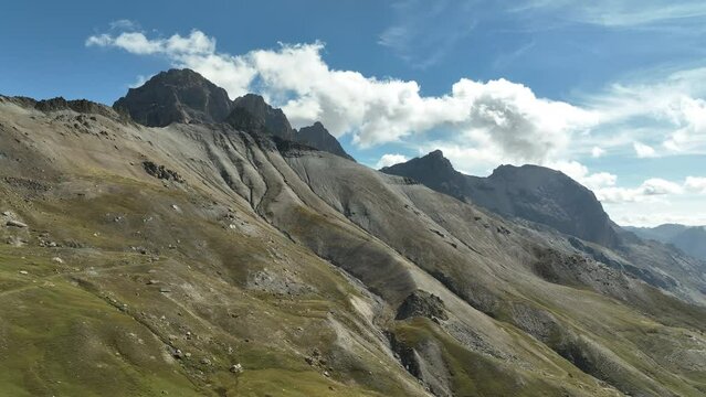Mountain side french alps with no trees high altitude aerial 