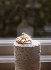 Close up of a ball of string against a window