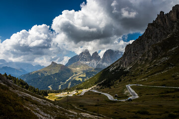 Fototapeta na wymiar Clouds over mountain massif Odle in Dolomites