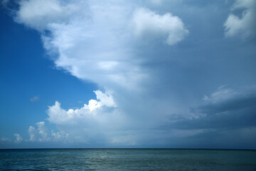 The detail of the front above the ocean surface with a dramatic change from sunny day to the rainy area. 