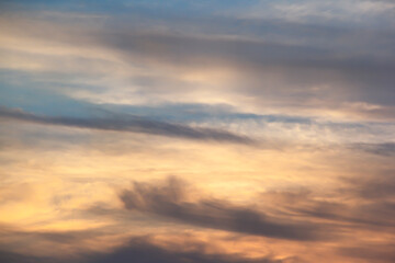 Soft lines of clouds in the sky at sunset