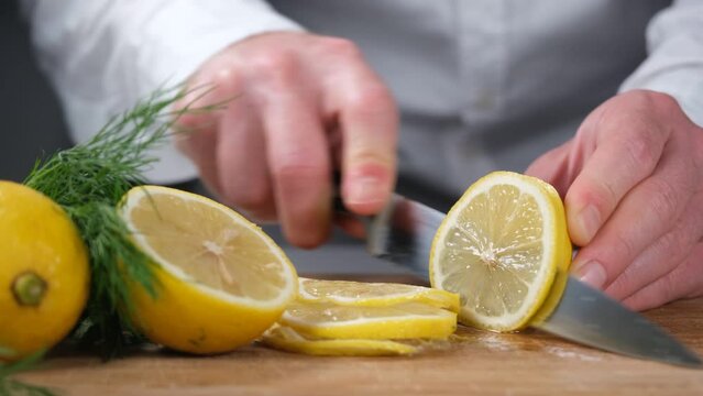 chef cutting lemon