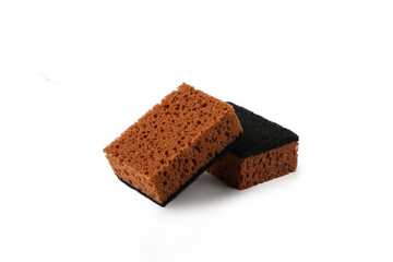Two brown Kitchen Dishwashing Sponges for washing dishes isolated on white background, cut out. Cleaning home concept.