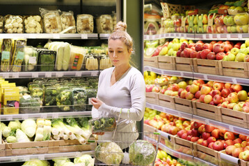 Woman buying fruits and vegetables at the market
