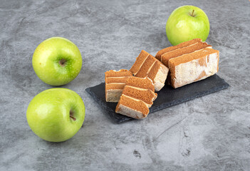 Sliced apple pastille on a stone serving board.