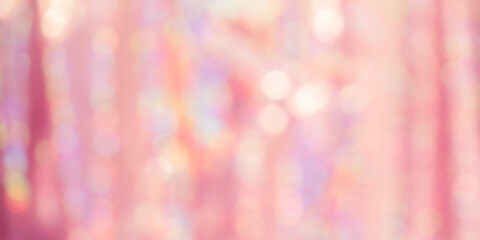 The background is pink a shiny fabric, and defocus. Defocus light pink with iridescent color.