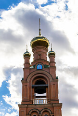 Christian church cross in high steeple tower for prayer