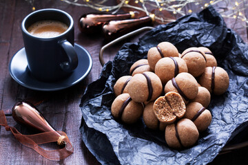 Lady's kisses, traditional Italian nut cookies with coffee and chocolate filling.