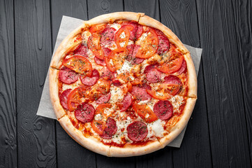 Tasty pizza and cooking ingredients tomatoes basil