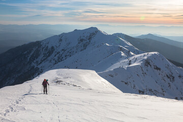 Fototapeta na wymiar Skitour in a big snowy mountains - beautiful winter landscape