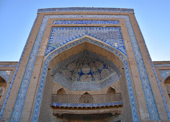 Close-up Madrassah of Ala-Kuli Khan in oriental style and ornment in the old city of Khiva (Xiva) in Uzbekistan