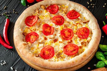 Tasty and big pizza with different types of meat