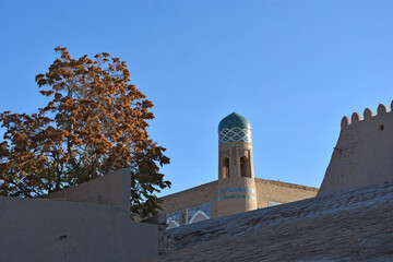 Old streets in oriental style of Khiva city in Uzbekistan with minarets, towers and mosques